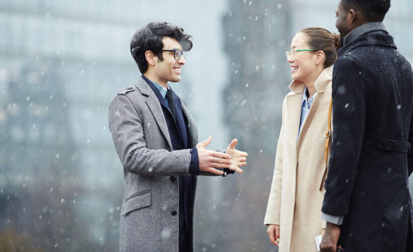 business-colleagues-chatting-snowy-street